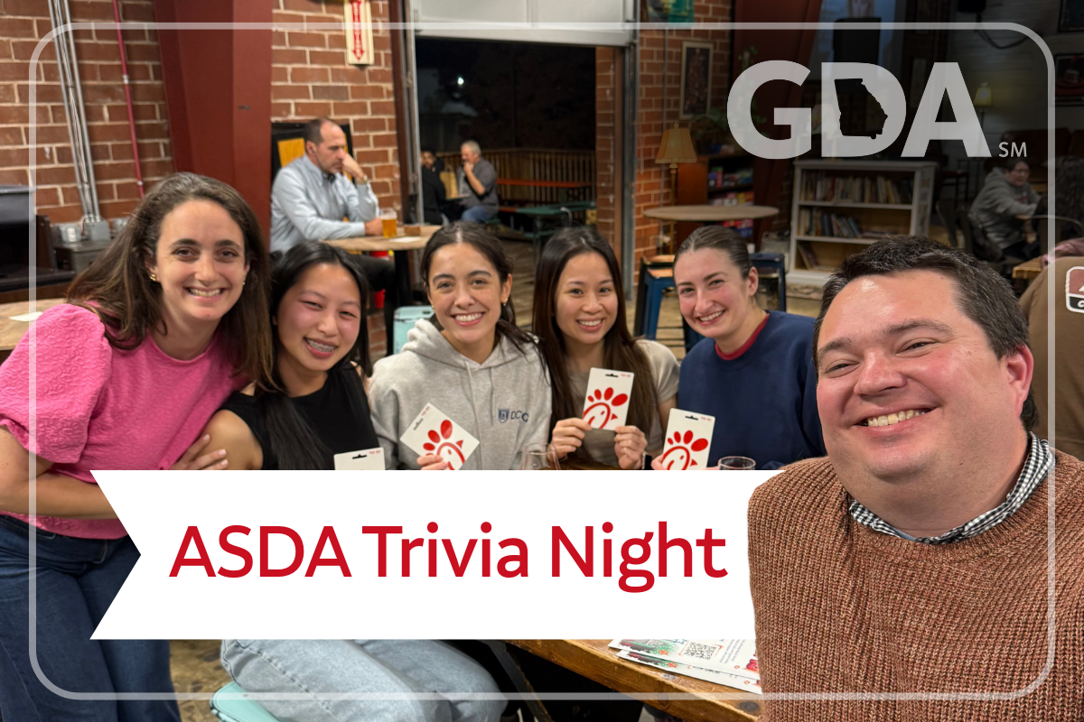 Trivia on Tap DCG Student winners with Jon and Janelle and their chick-fil-a gift card winnings.
